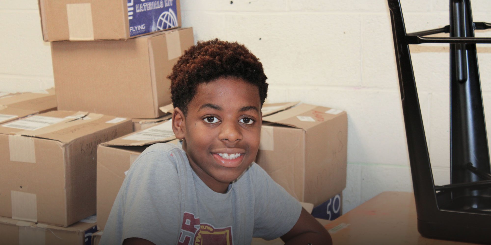 Smiling student working in classroom
